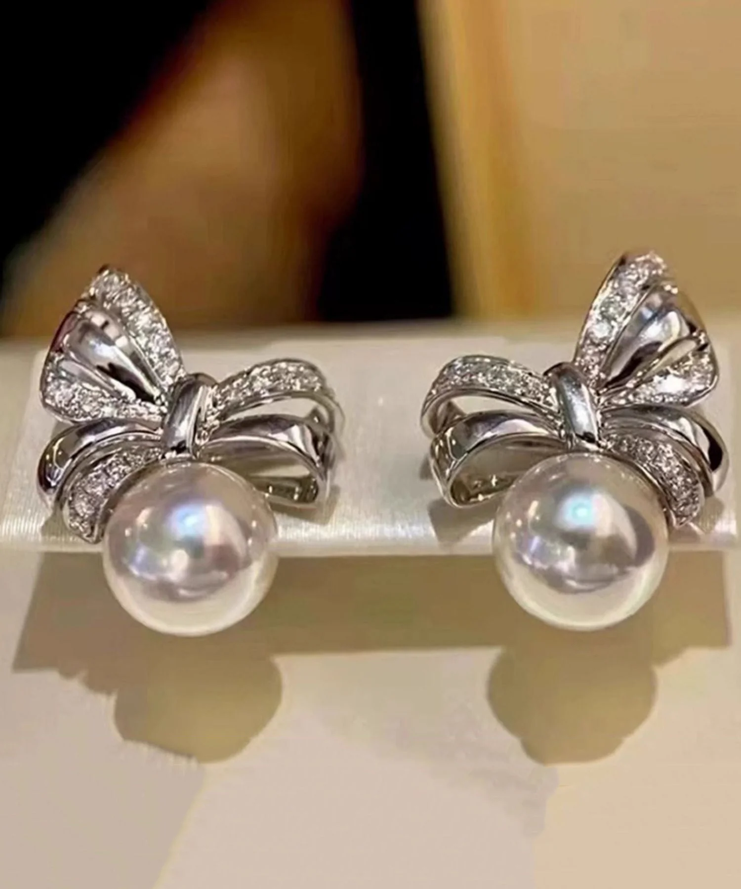 Beautiful White Bow Pearl Silver Stud Earrings - Image 2