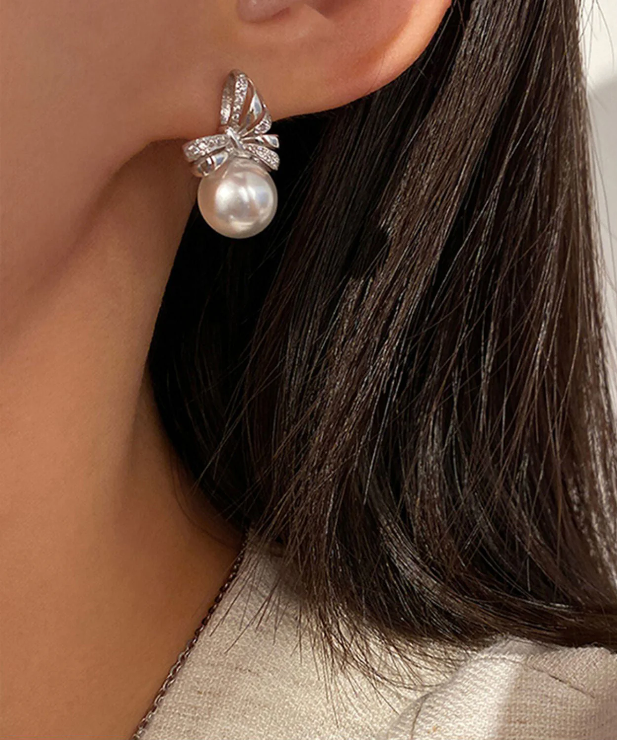 Beautiful White Bow Pearl Silver Stud Earrings - Image 3